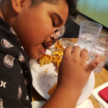 Jus' Jo's - Showing how much he loves his food. Is chicken and waffles Chicken-n-Waffle - Breakfast & Brunch Near Me - Clovis, California