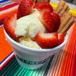 Churro sundae with fresh strawberries