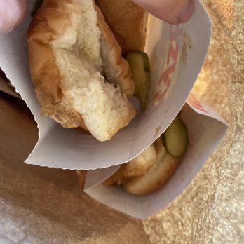 Krystal - a person holding a sandwich with pickles - Burgers Near Me - Knoxville, Tennessee Krystal - a person holding a sandwich with pickles - Burgers Near Me - Knoxville, Tennessee