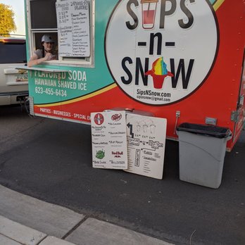 Sips-n-Snows - ows a woman looking out the window of a truck - Food Trucks Near Me Sips-n-Snows - ows a woman looking out the window of a truck - Food Trucks Near Me