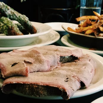 Le Pichet - Pressed beef tongue open-faced sandwich, beef rib bones, and fries. Soooo good - French Near Me - Seattle, Washington
