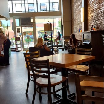 Port City Java - people sitting at tables in a restaurant - Coffee & Tea Near Me - Wilmington, North Carolina