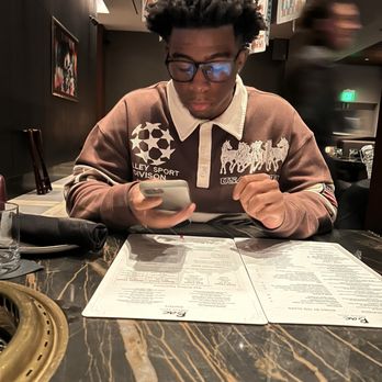 Bae Korean Grill - He was reviewing the menu - Korean Near Me - Hollywood, Florida Bae Korean Grill - He was reviewing the menu - Korean Near Me - Hollywood, Florida