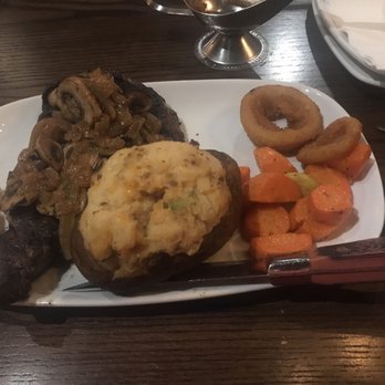 MR MIKES - 16oz mikes Rib eye medium well loaded with sautéed mushrooms and onions and loaded stuffed baked potato and carrots for my sides - Steakhouses Near Me - Coquitlam, British Columbia