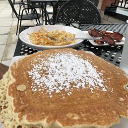 Pancakes, hash browns and bacon