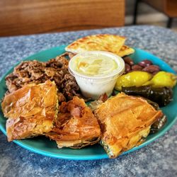 Olympia Cafe - GREEK COMBO $17.49 Gyro Meat (Lamb, Beef or Chicken) Pita Bread, Spinach Ple & 2 Dolmades