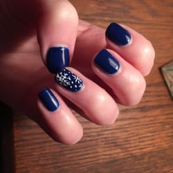 Luxe Nail Bar Salon - Dark blue gel manicure, with white snowflake art.