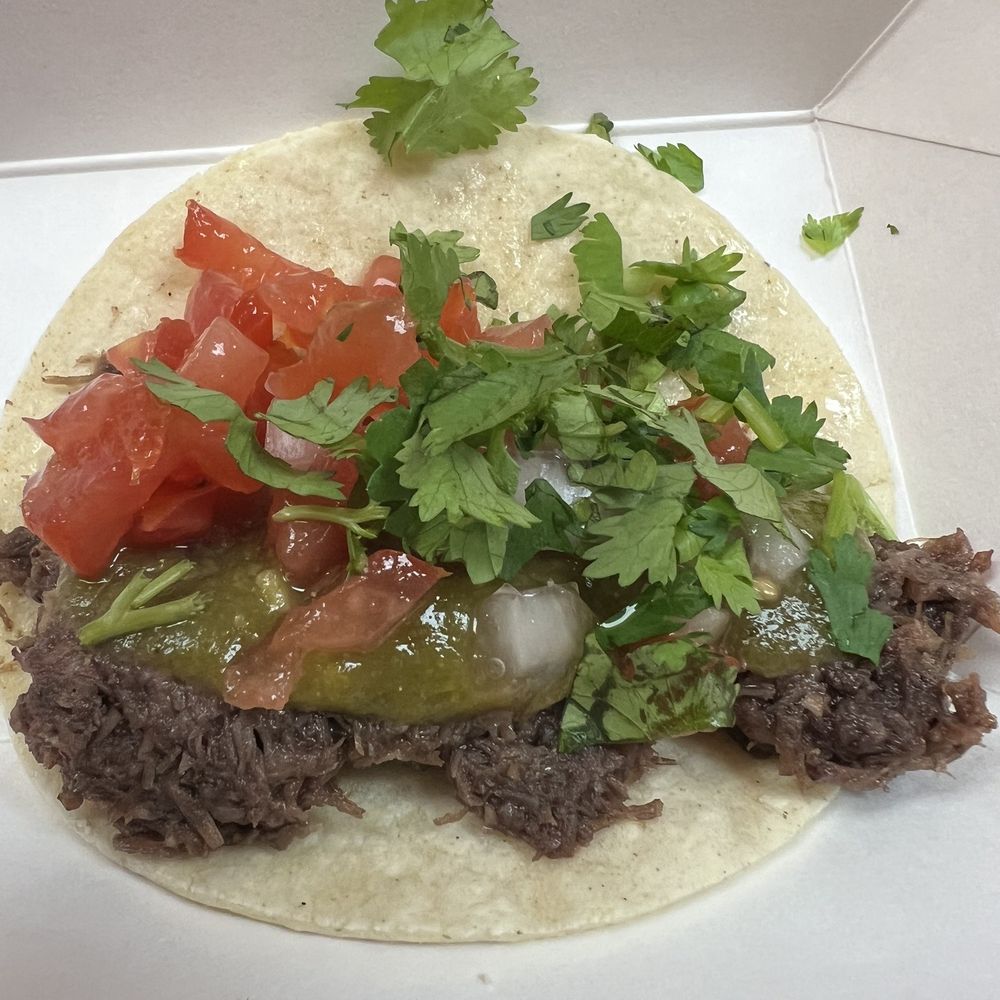 Barbacoa taco - i added the toppings from their bar Barbacoa taco - i added the toppings from their bar
