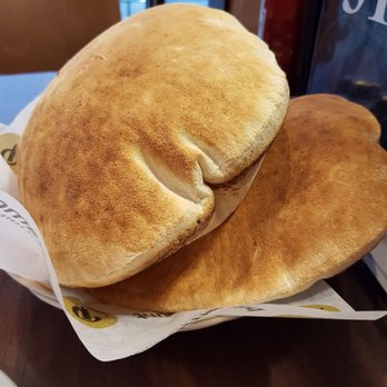 Paramount Fine Foods - Complimentary puffed pita bread...so fresh and good! - Lebanese Near Me - Edmonton, Alberta