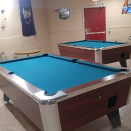 two pool tables in a game room