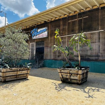 Hometown Bar-B-Que - ows two planters in front of a building - Barbeque Near Me - Miami, Florida