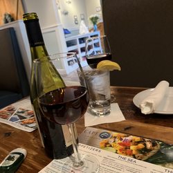 Cape Fear Seafood Company - Half off wine every Tuesday but make sure they are in the green lettering to get half off .