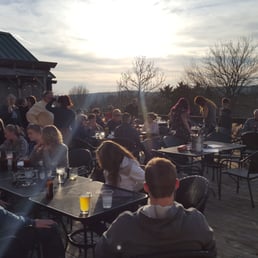 Nice little crowd sitting out on the deck listening to music Nice little crowd sitting out on the deck listening to music