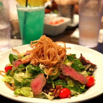 Dave & Buster's Ala Moana - Fire-grilled steak salad and a coconut rum island punch. - Arcades Near Me - Honolulu, Hawaii