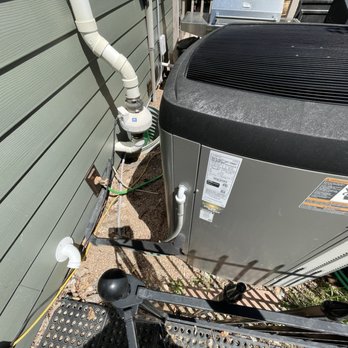 Apex Installations - Old AC location 2ft from home with lineset routed underneath the water spigot. - Heating & Air Conditioning/HVAC Near Me Apex Installations - Old AC location 2ft from home with lineset routed underneath the water spigot. - Heating & Air Conditioning/HVAC Near Me