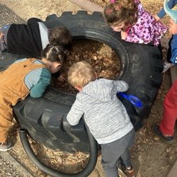 Exploring the outside classroom!  The outdoor space encourages curiosity and discovery.