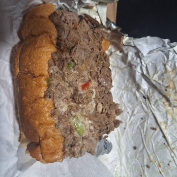 The Original Philly's - Pepper Cheesesteak + added mushrooms Sandwich - one half of the sandwich - Sandwiches Near Me - Seattle, Washington The Original Philly's - Pepper Cheesesteak + added mushrooms Sandwich - one half of the sandwich - Sandwiches Near Me - Seattle, Washington