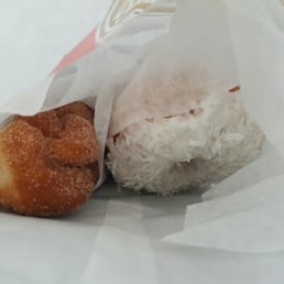 Sugared cinnamon twist of the left, coconut iced donut on the right.