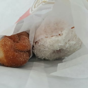 Shipley Do-Nuts - Sugared cinnamon twist of the left, coconut iced donut on the right. - Donuts Near Me - San Antonio, Texas