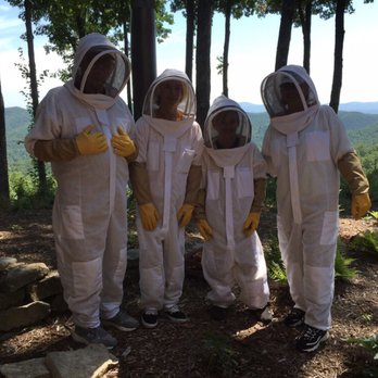 Killer Bees Honey - a group of beekeepers dressed in bee suits - Honey Near Me