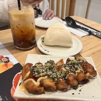 Kyuramen - Cherry Hill - Pan Fried Dumplings (6pcs) (6pcs), Pork Bao Buns ( 2pcs) 2pcs and Thai Iced Tea L - Ramen Near Me - Cherry Hill, New Jersey
