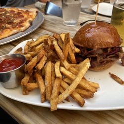 Jackie O's Brewpub - Brisket and cheese sandwich with crispy fries on a toasted bun. So good!