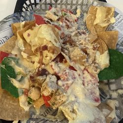 Riptides Grill And Tiki Bar - Nachos were delicious. Already dug in but flavor is great! Get them!
