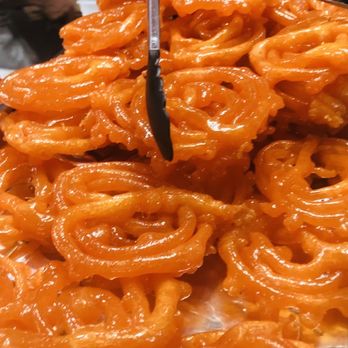 Ittadi Garden & Grill - Jalebis are small, bright yellow, web-shaped cakes similar to funnel cakes, popular in Bangladesh, Nepal, and Pakistan. - Indian Near Me - Jackson Heights, New York