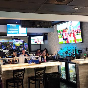 Hurricane Eddie's - Downstairs bar/eating area Looking out - Sports Bars Near Me - Clearwater Beach, Florida