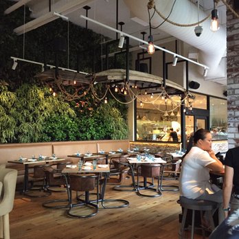 Herringbone Waikiki - Interior of dining area.  We like that living wall! - Seafood Near Me - Honolulu, Hawaii