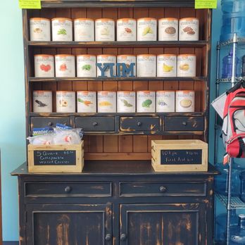The Watering Well - a wooden cabinet with many containers of water - Water Stores Near Me - Prescott, Arizona The Watering Well - a wooden cabinet with many containers of water - Water Stores Near Me - Prescott, Arizona