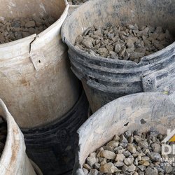 Dry Basement Systems - Wash stones for pitching drainage pipe and managing water.