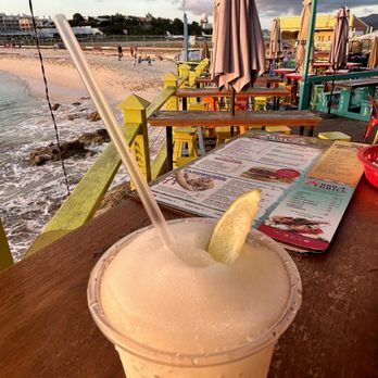 Sunset Beach Bar & Grill - Enjoying a Pina Colada in front of Maho Beach. - American Near Me - Sint Maarten, Virgin Islands Sunset Beach Bar & Grill - Enjoying a Pina Colada in front of Maho Beach. - American Near Me - Sint Maarten, Virgin Islands