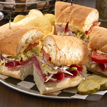 Carbone's Pizzeria - a plate of sandwiches and chips - Pizza Near Me - Eagan, Minnesota