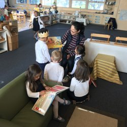 Parent reading to children.