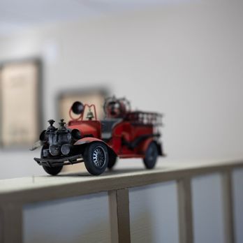 Keene Cafe - a toy fire truck on a railing - Diners Near Me - Keene, California