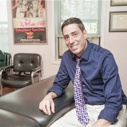 Dr. Adam relaxes on an adjustment table.