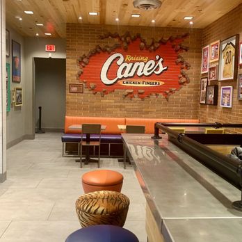 Raising Cane's Chicken Fingers - the interior of a restaurant - Chicken Shop Near Me - Gainesville, Florida Raising Cane's Chicken Fingers - the interior of a restaurant - Chicken Shop Near Me - Gainesville, Florida