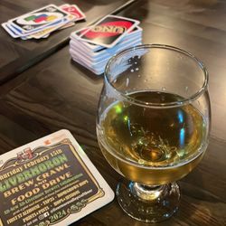 Buzzin On Hops Bottle Shop & Taproom - Play a hand and stay awhile.