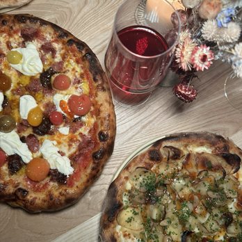 Solimar - Left : sausage confit tomato ricotta pizza; Right: garlic potato pizza - Pizza Near Me - Sacramento, California Solimar - Left : sausage confit tomato ricotta pizza; Right: garlic potato pizza - Pizza Near Me - Sacramento, California