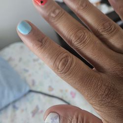 Pearl Nail & Spa - Just one of many stickers they put on that either pealed or popped off the heart on the red nail popped off at the bottom of my nail bed