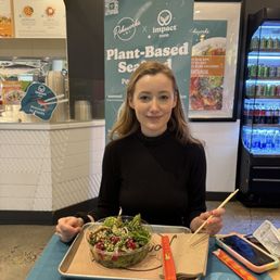 Friend eating impact tuna vegan poke bowl Friend eating impact tuna vegan poke bowl