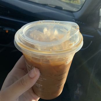 Starbucks - a hand holding a cup of iced coffee - Coffee & Tea Near Me - Fairfield, California Starbucks - a hand holding a cup of iced coffee - Coffee & Tea Near Me - Fairfield, California