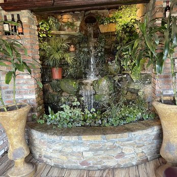 Moustos Pasta & Grill - Fountain at entrance - Italian Near Me - Paris, Tennessee Moustos Pasta & Grill - Fountain at entrance - Italian Near Me - Paris, Tennessee