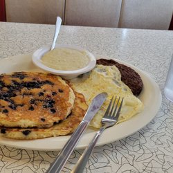 That Flippin' Egg - Pancakes Breakfast   with eggs  sausage abd grits