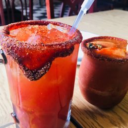 a bloody drink and a pineapple drink