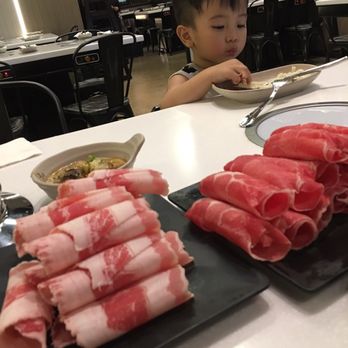 Spring Shabu-Shabu - My baby brother enjoying some gains (fatty beef and rib eye) - Hot Pot Near Me - Boston, Massachusetts