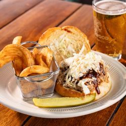 Deadwood Bar & Grill - BBQ Pulled Pork --
Slow roasted, Jack Daniel's BBQ sauce, coleslaw, house-made onion roll