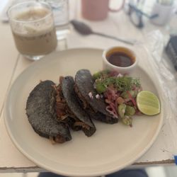 Birria tacos on blue corn tortilla
