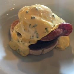 The Wilton Arms - Grilled bury black pudding on a muffin with bacon, poached egg and hollandaise